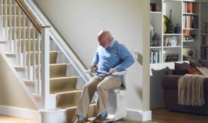 old man using a stairlift