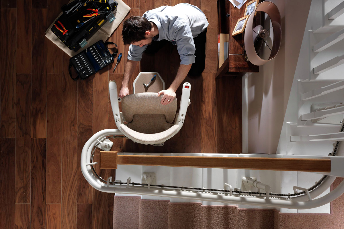 Curved stairlift being installed