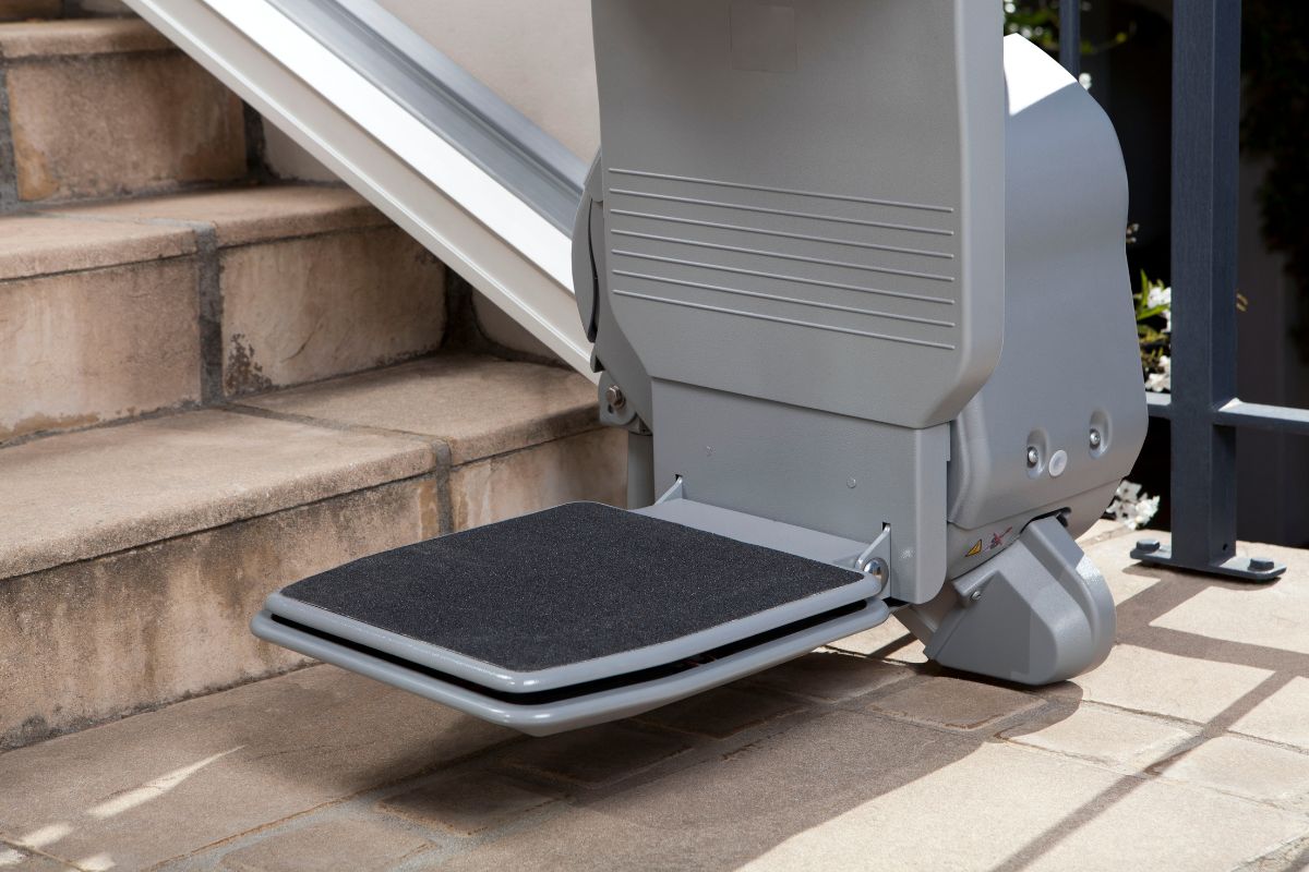 Outdoor stairlift footrest close up.